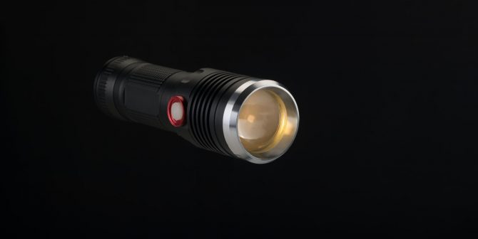 Tactical flashlight on a black background Tactical flashlight on a black background